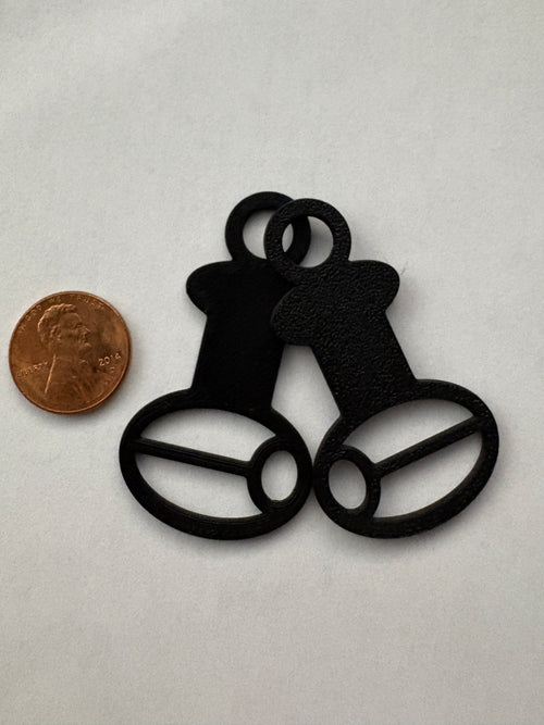Close-up of Halloween-themed floss drop bobbin colors including black and slime green
