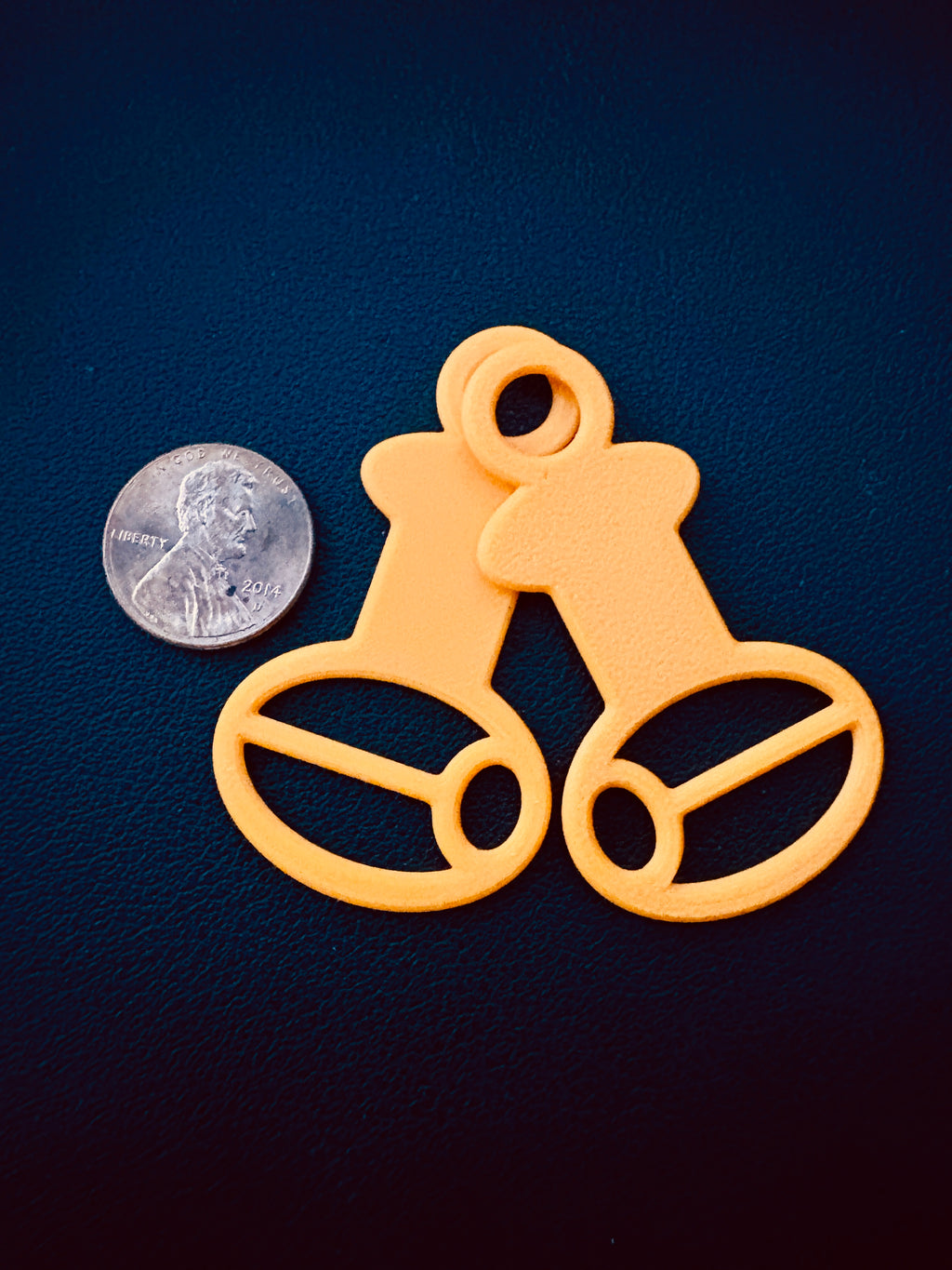 Orange no-kink floss drop bobbin for cross stitch and embroidery floss storage